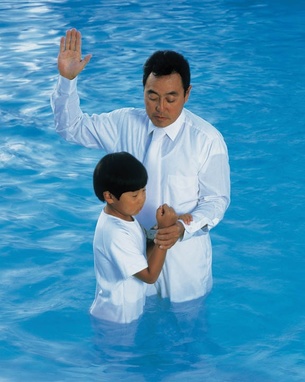 Young Asian boy being baptized into the LDS Church