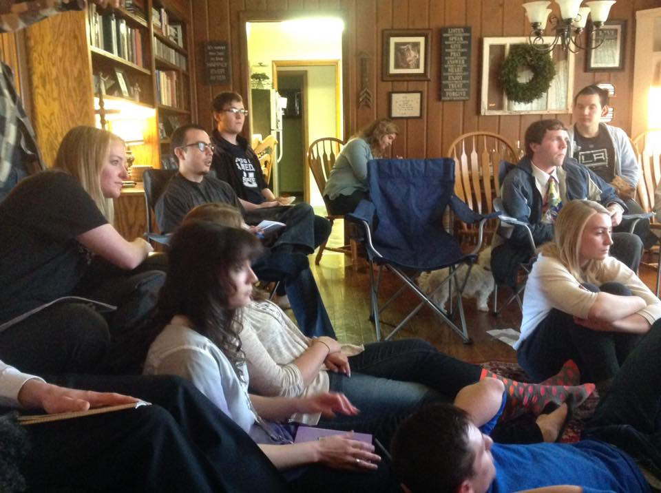 C. Randall Nicholson and several members of the Logan YSA 35th Ward of the Church of Jesus Christ of Latter-day Saints watching General Conference in Bishop Doug Corbridge's home