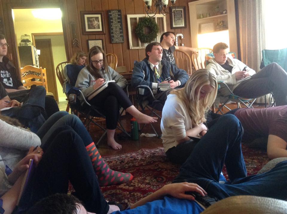 C. Randall Nicholson and several members of the Logan YSA 35th Ward of the Church of Jesus Christ of Latter-day Saints watching General Conference in Bishop Doug Corbridge's home