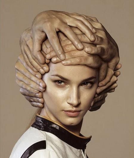 Attractive woman wearing a helmet made of hands, from a motorcycle helmet advertisement, christened 